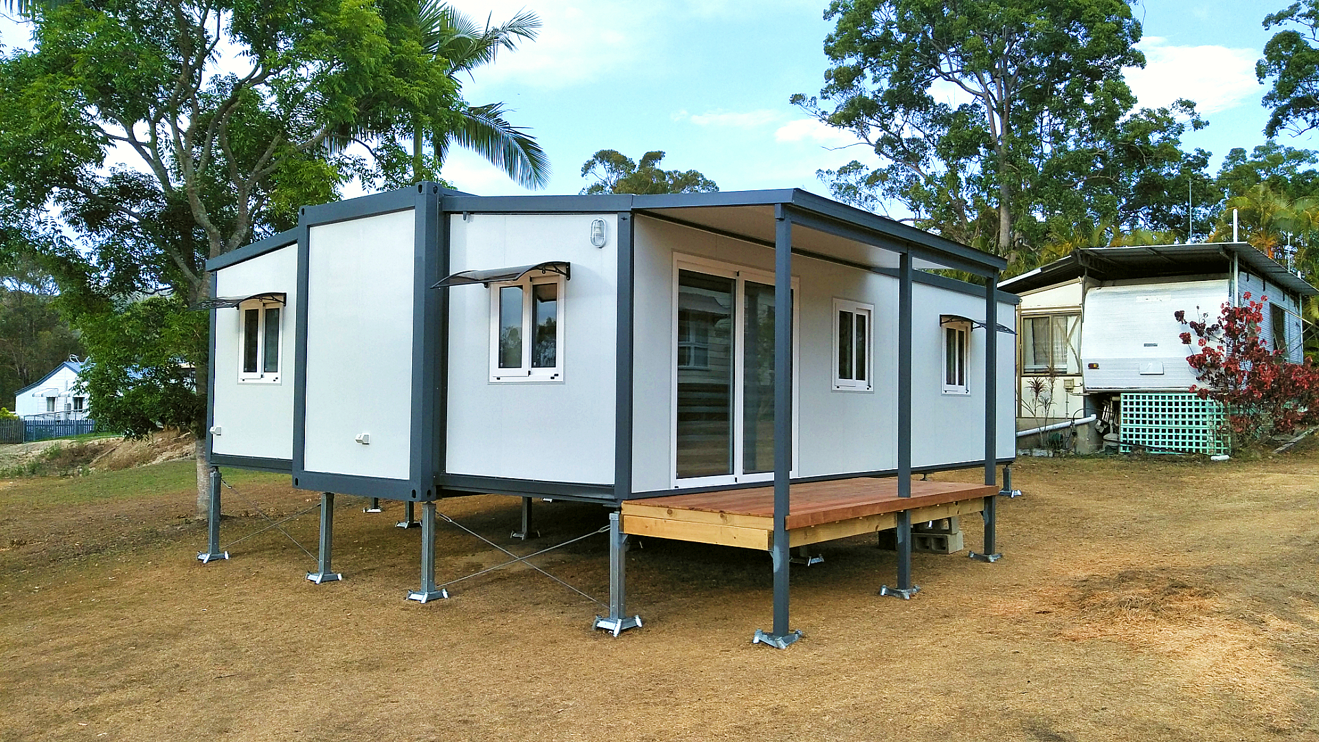 tiny home on steel footings sitting in cleared land