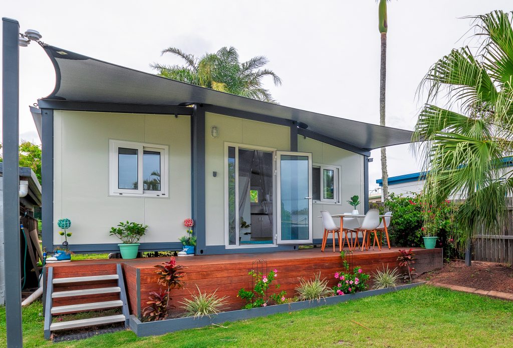 complete small home with awning and deck- landscaped